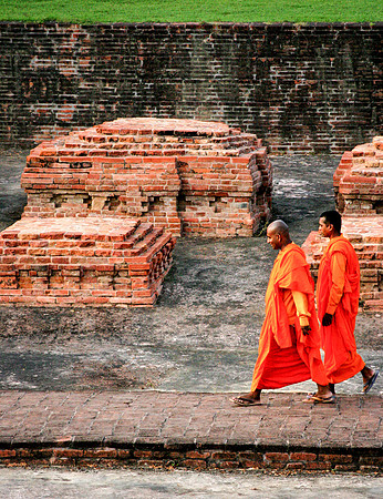 Monks before small stupas at Sarnath